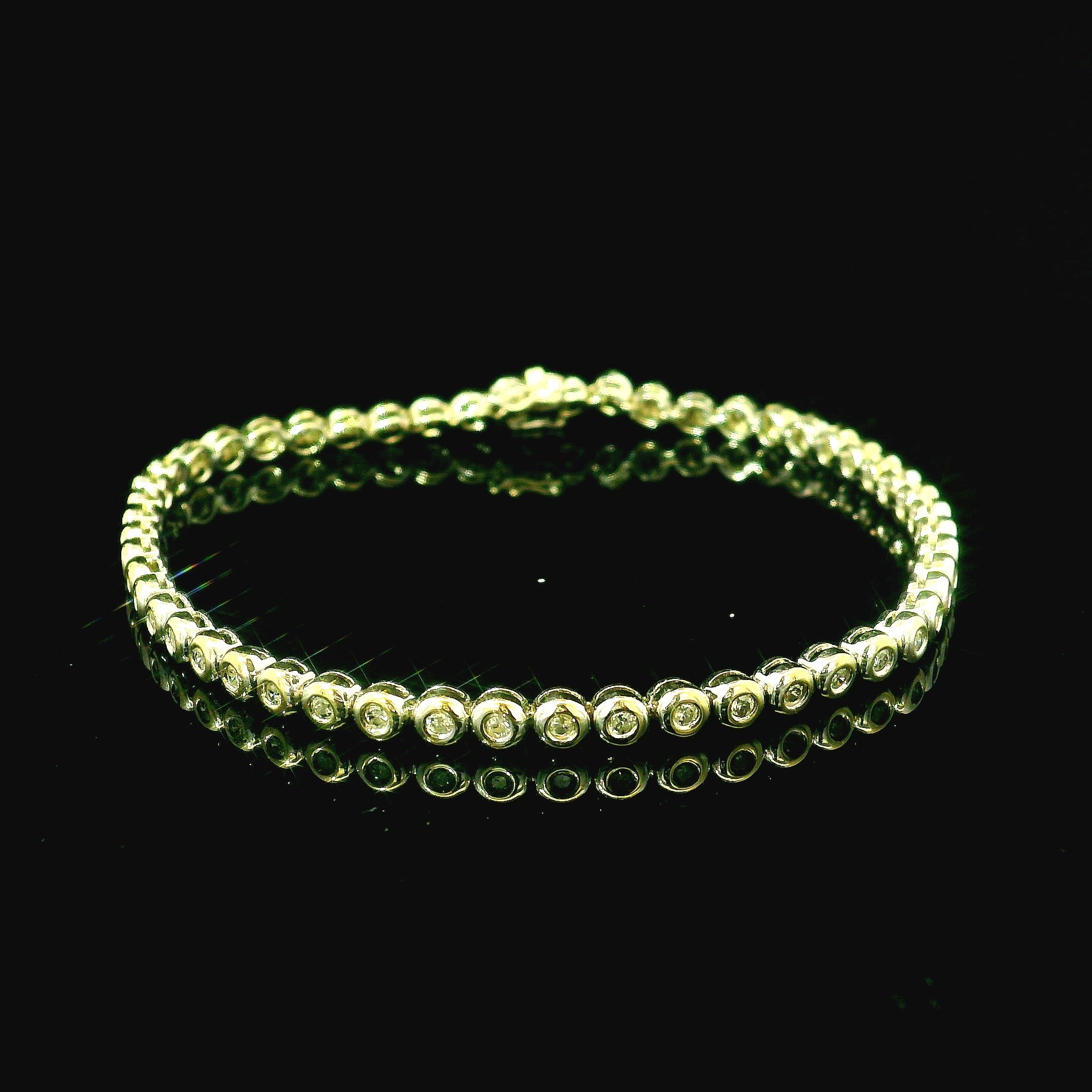 white gold line bracelet with round brilliant cut diamonds. diamond bracelet for women. diamond jewellery west malling