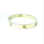 white gold bangle. white gold bracelet for women. white gold bangle screw design. screw design bangle