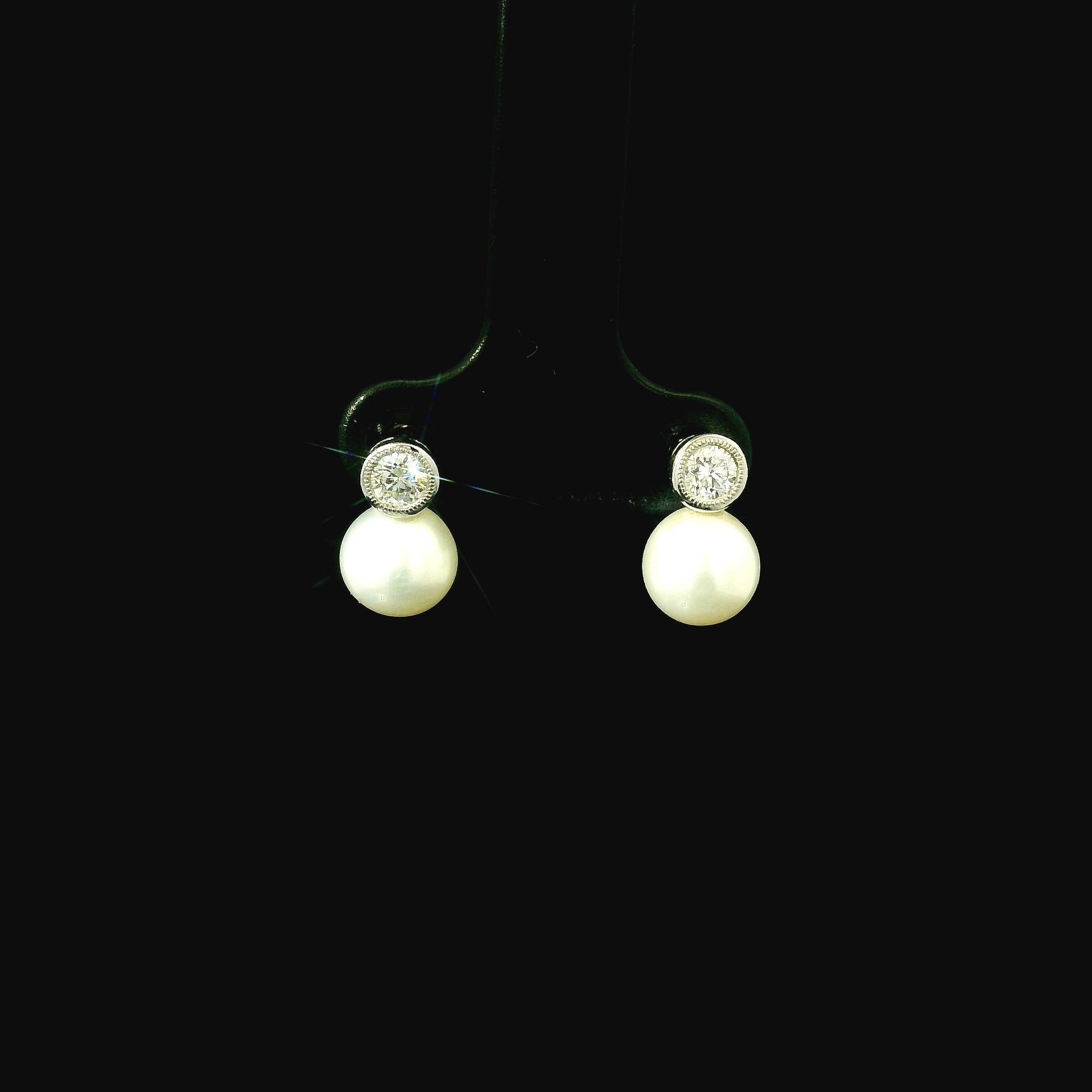 round brilliant cut diamond earings. diamond and pearl jewellery. pearl earrings. west malling jewellery