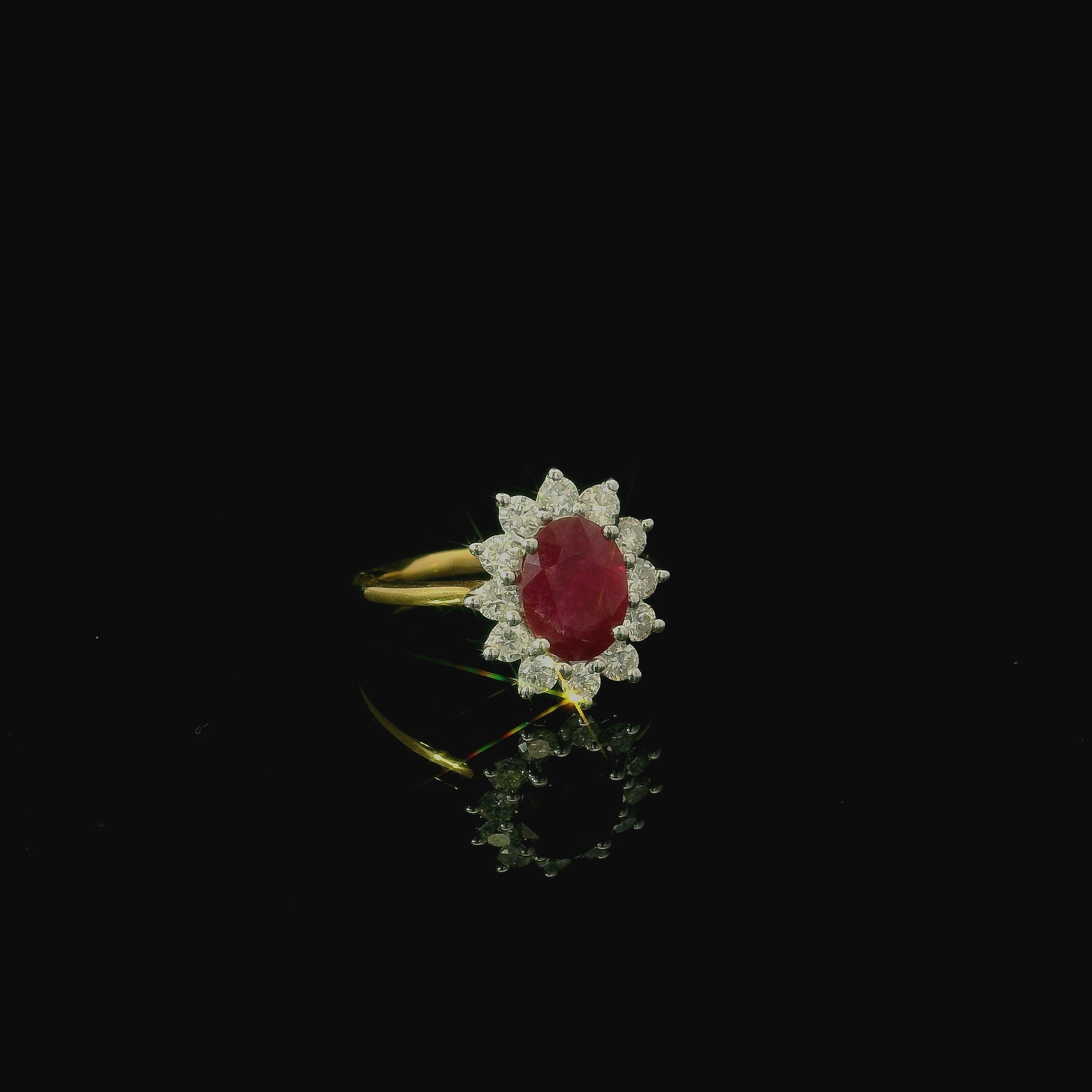 oval ruby ring with brilliant cut diamonds. engagement ring for women. yellow and white gold ring. gold rings for women