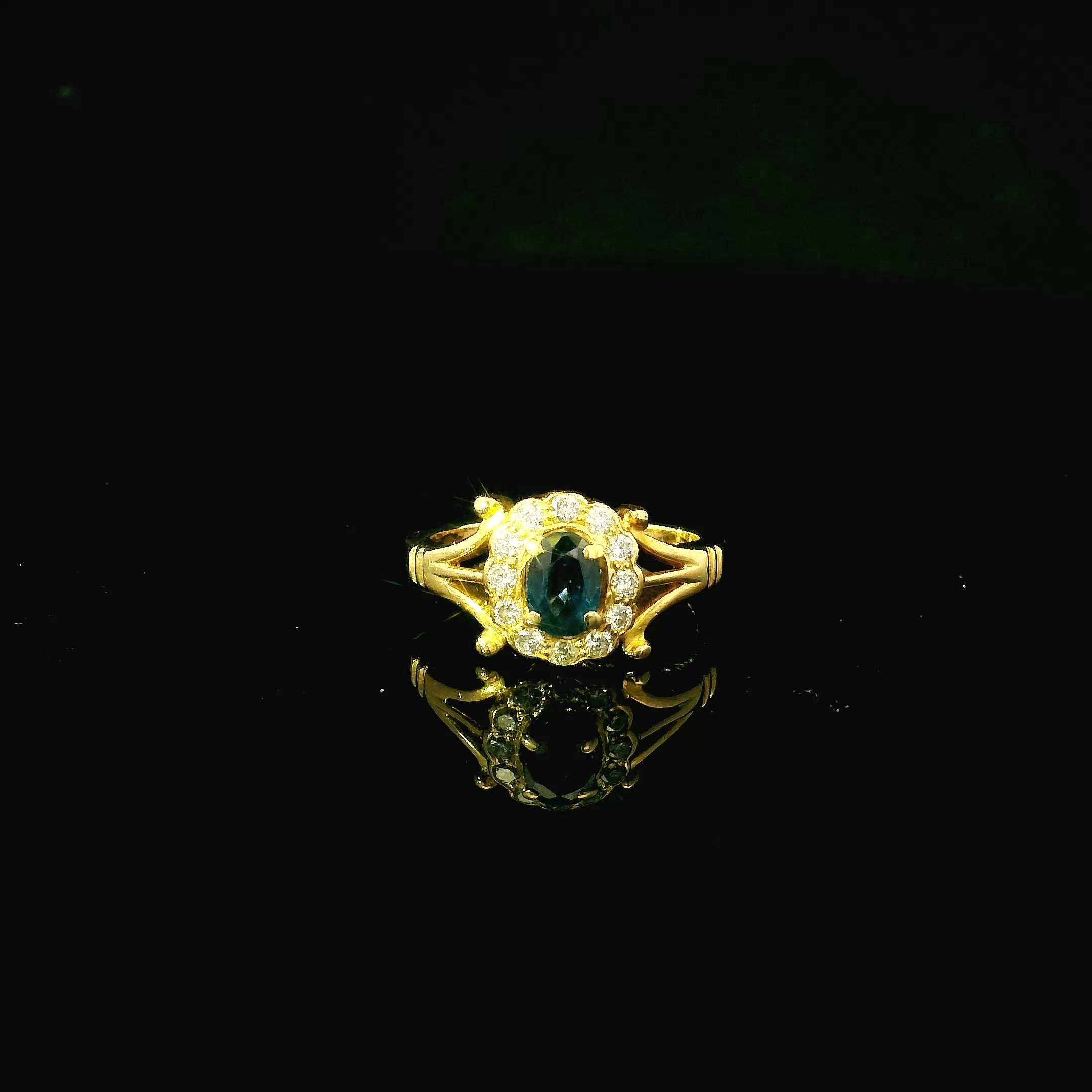 gold ring with oval sapphire stone and diamond cluster - vintage inspired