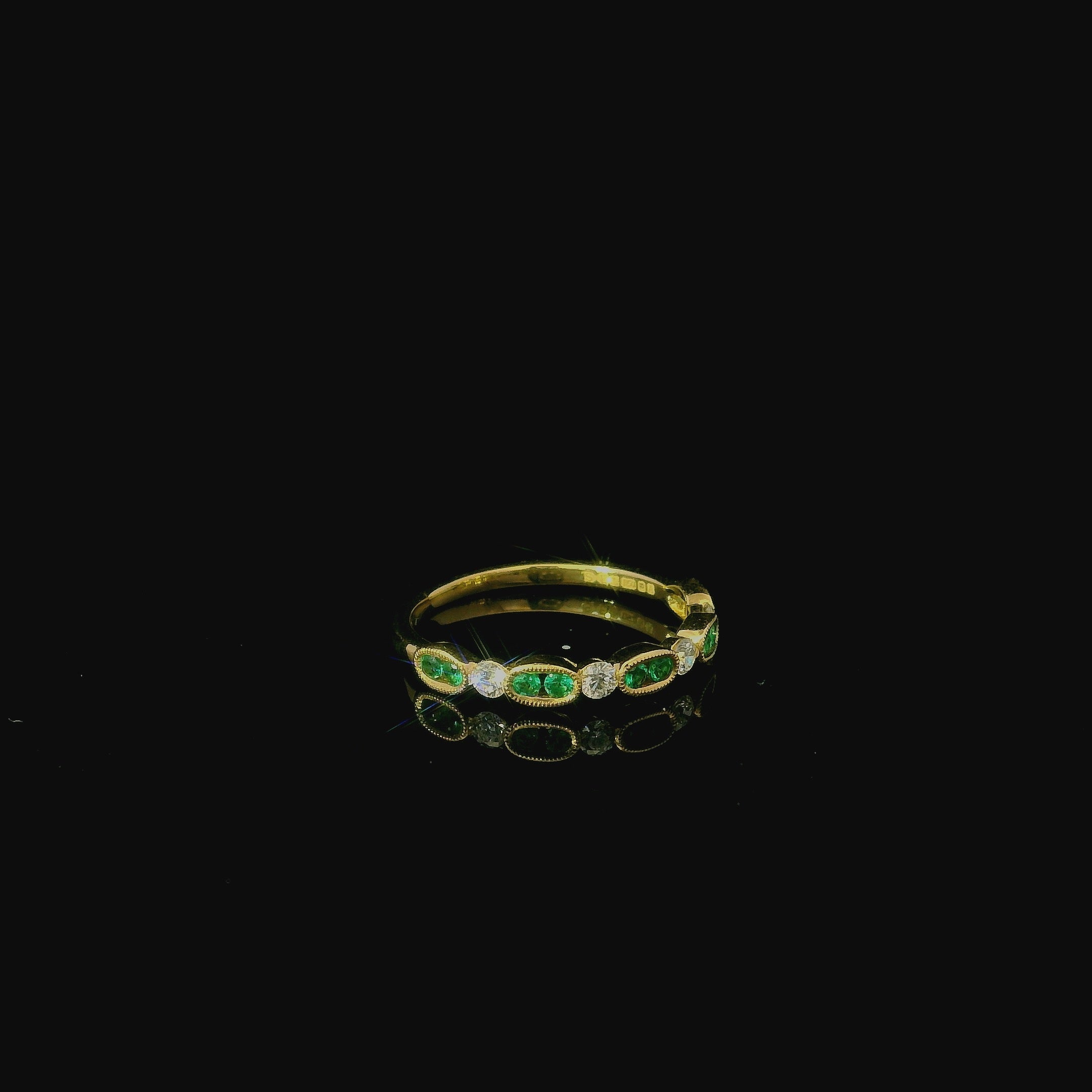 emerald and diamond yellow gold ring. half eternity ring for women. second hand yellow gold rings. minimal emerald ring. 