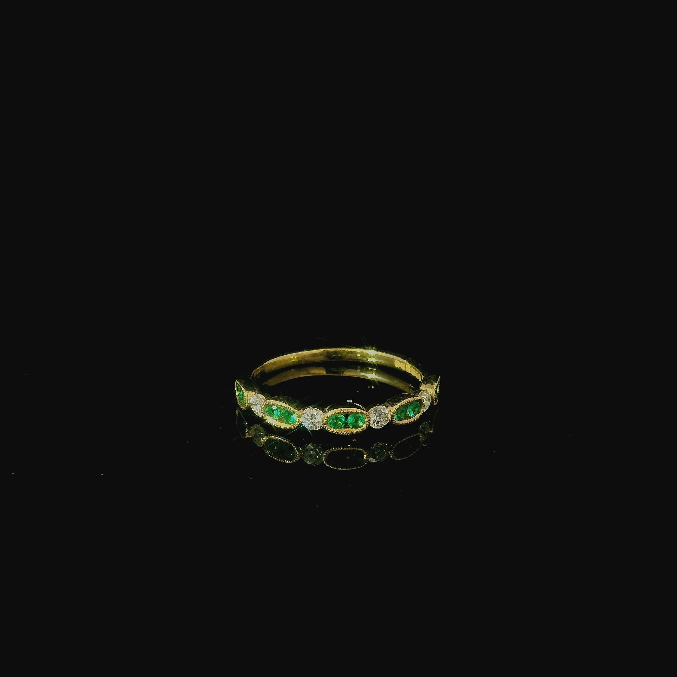 yellow gold ring with emerald gem stones and brilliant cut diamonds. maidstone.