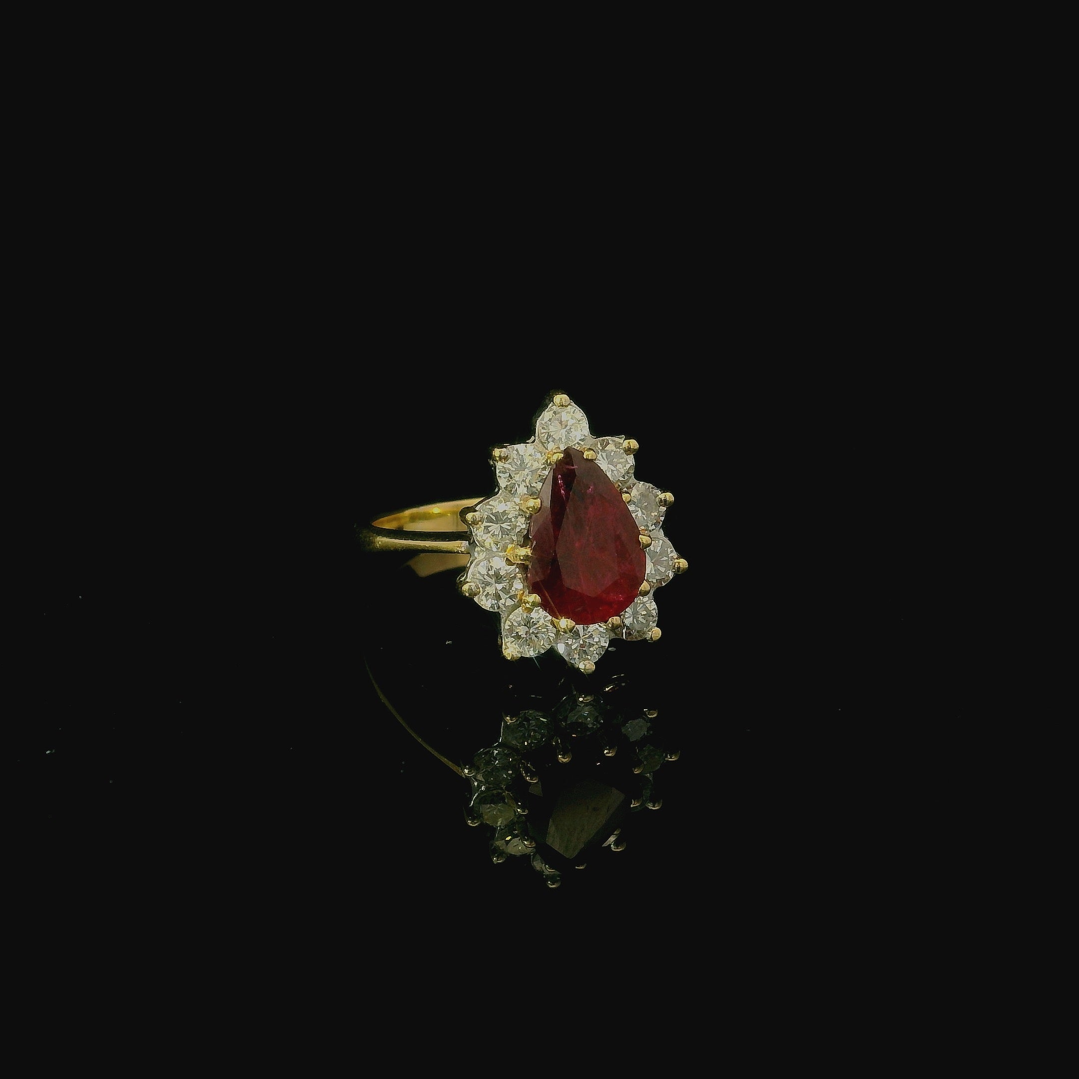red ruby pear cut shape gemstone. vintage inspired gold ring. gold ring for women. costume jewellery.