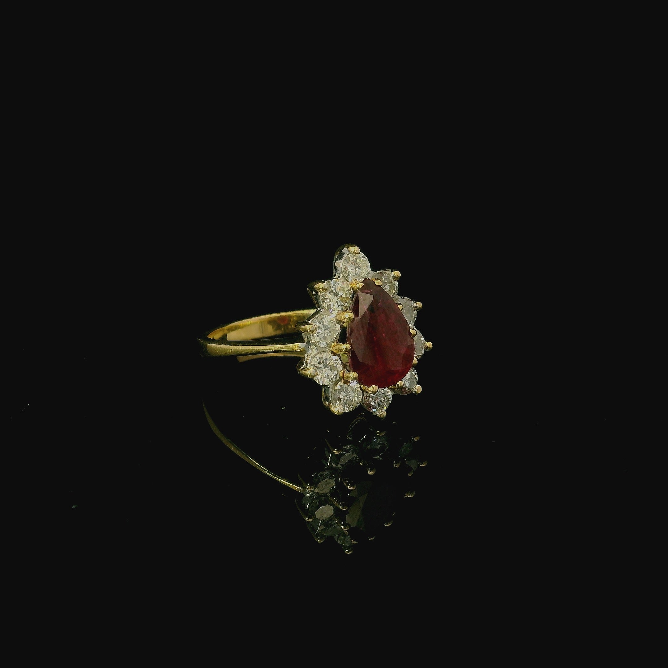 red ruby and diamond yellow gold ring. second hand vintage antique ring. engagement ring for women. pear cut diamond.