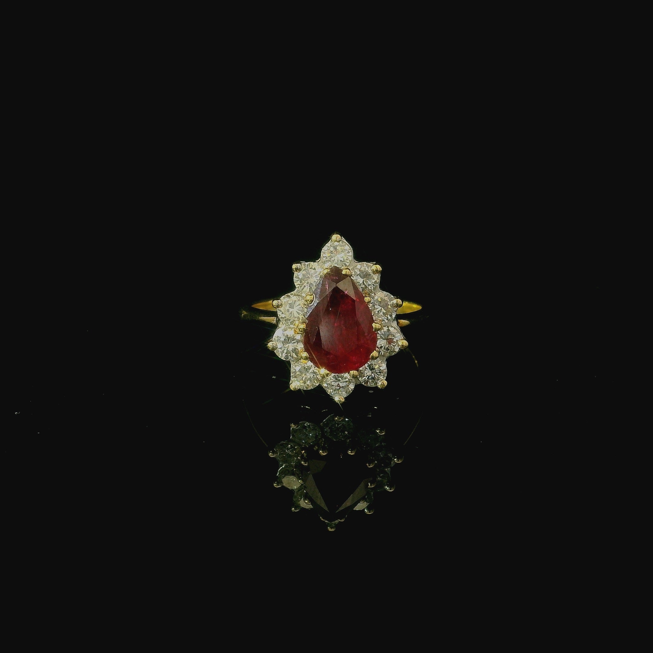 red ruby gemstone. ring to symbolise love, passion and prosperty. Vibrant blood red ruby gem stone on gold ring.