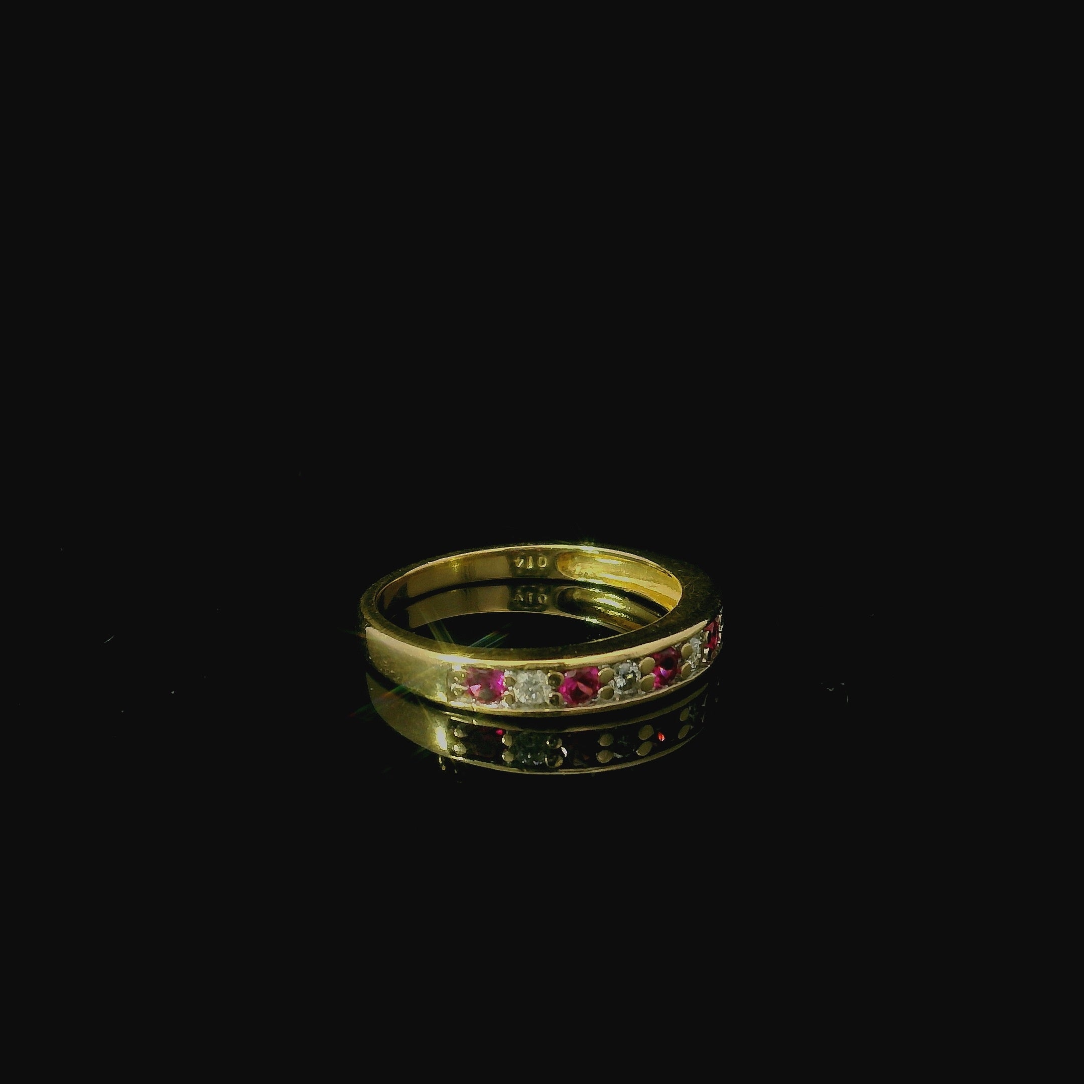 yellow gold ring for women with rubies. yellow gold eternity ring, eternity ring for women in kent