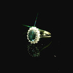 dark green emerald oval cut sapphire. white gold ring for women