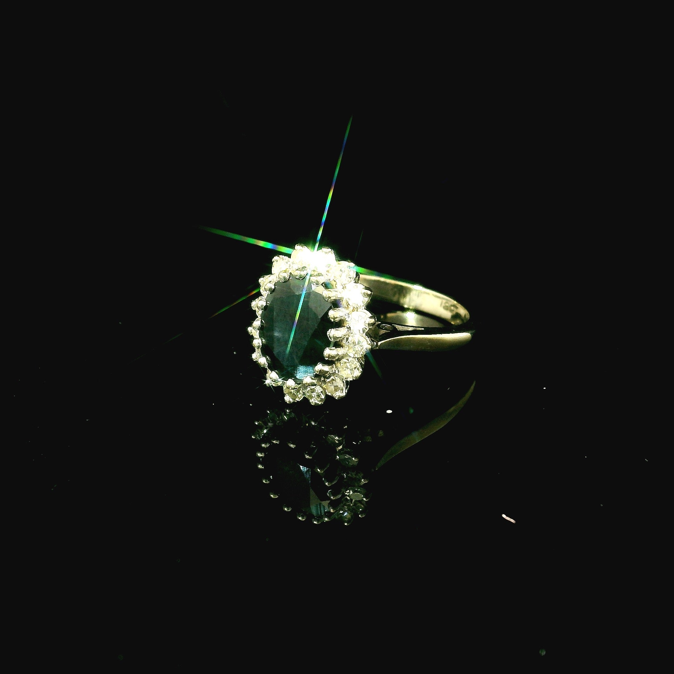 dark green emerald oval cut sapphire. white gold ring for women