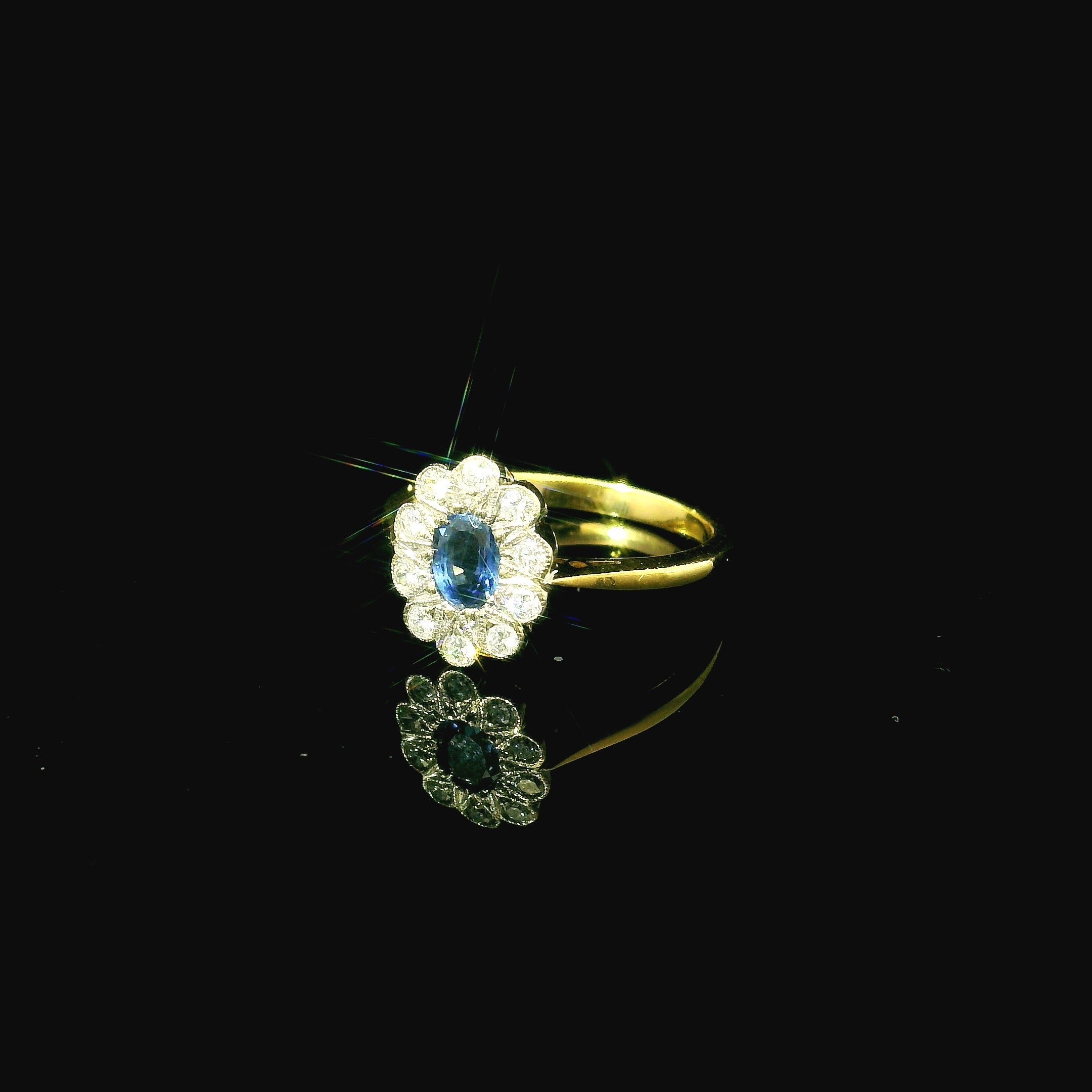 blue sapphire daisy floral inspired yellow gold ring. blue sapphire ring. yellow gold ring. diamond ring. 