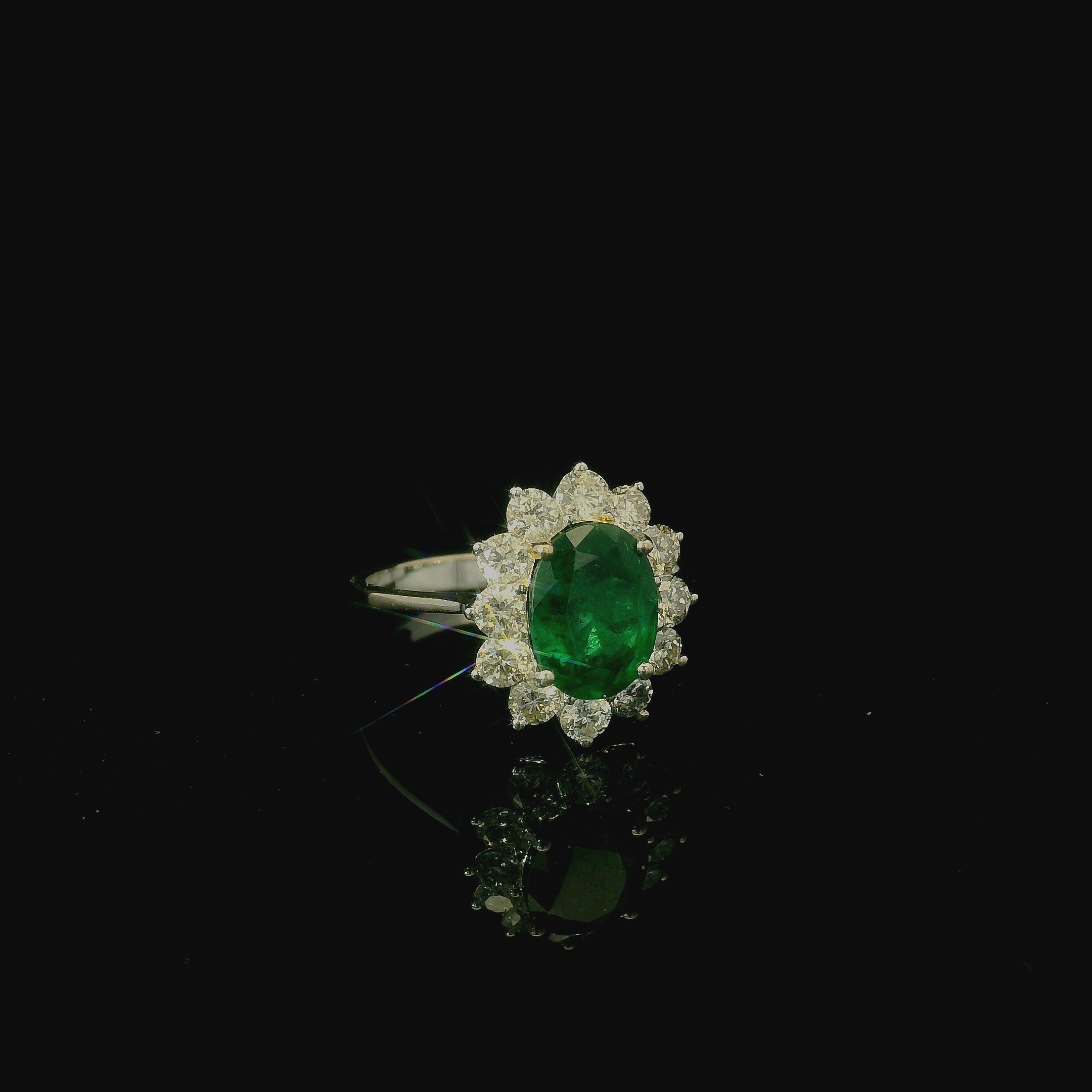 traditional vintage and antique jewellery. one of a kind ring. emerald ring with diamonds. flower style bold ring. timeless jewellery. west malling