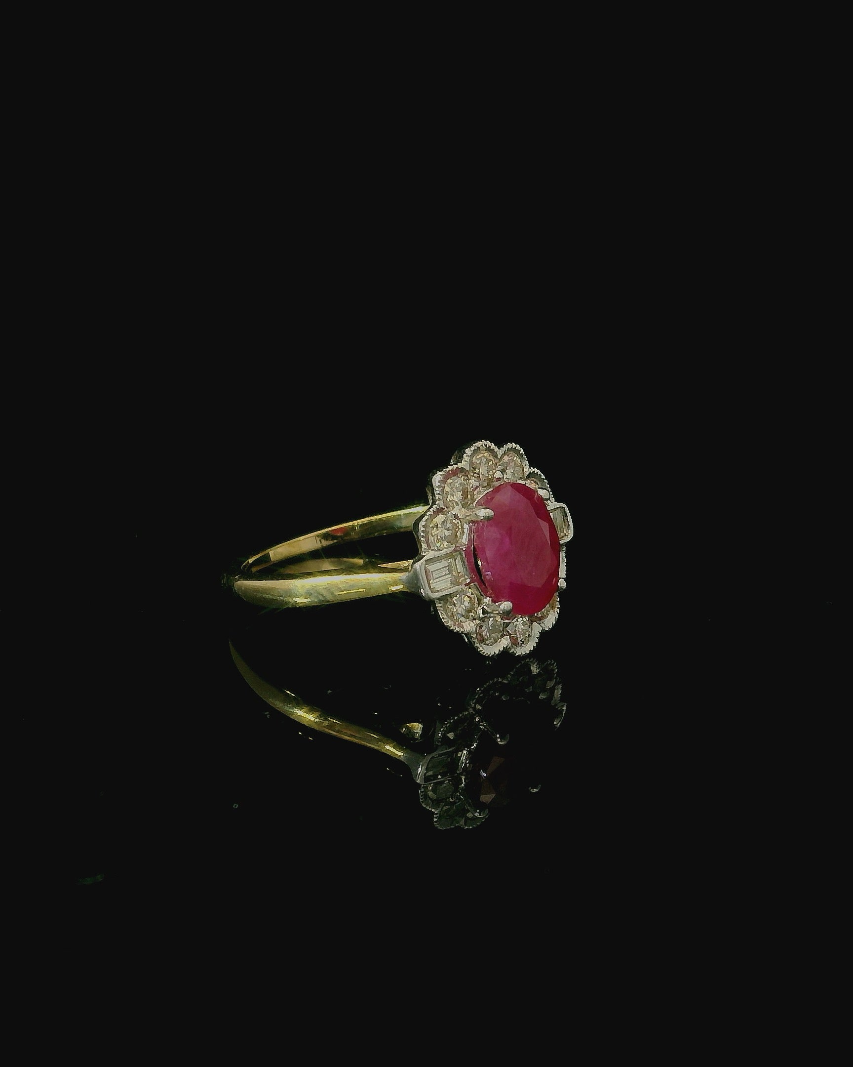 oval cut ruby ring. diamond cluster. yellow gold. birthday gift for women. flower shaped diamond ring.