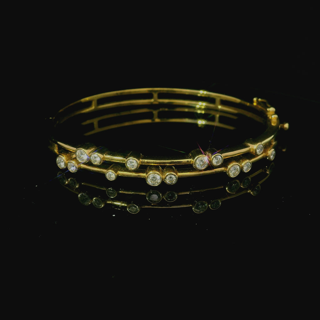 yellow gold bangle. yellow gold bracelet. yellow gold bangle with diamonds. diamond bracelet. 