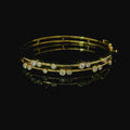 yellow gold bangle. yellow gold bracelet. yellow gold bangle with diamonds. diamond bracelet. 