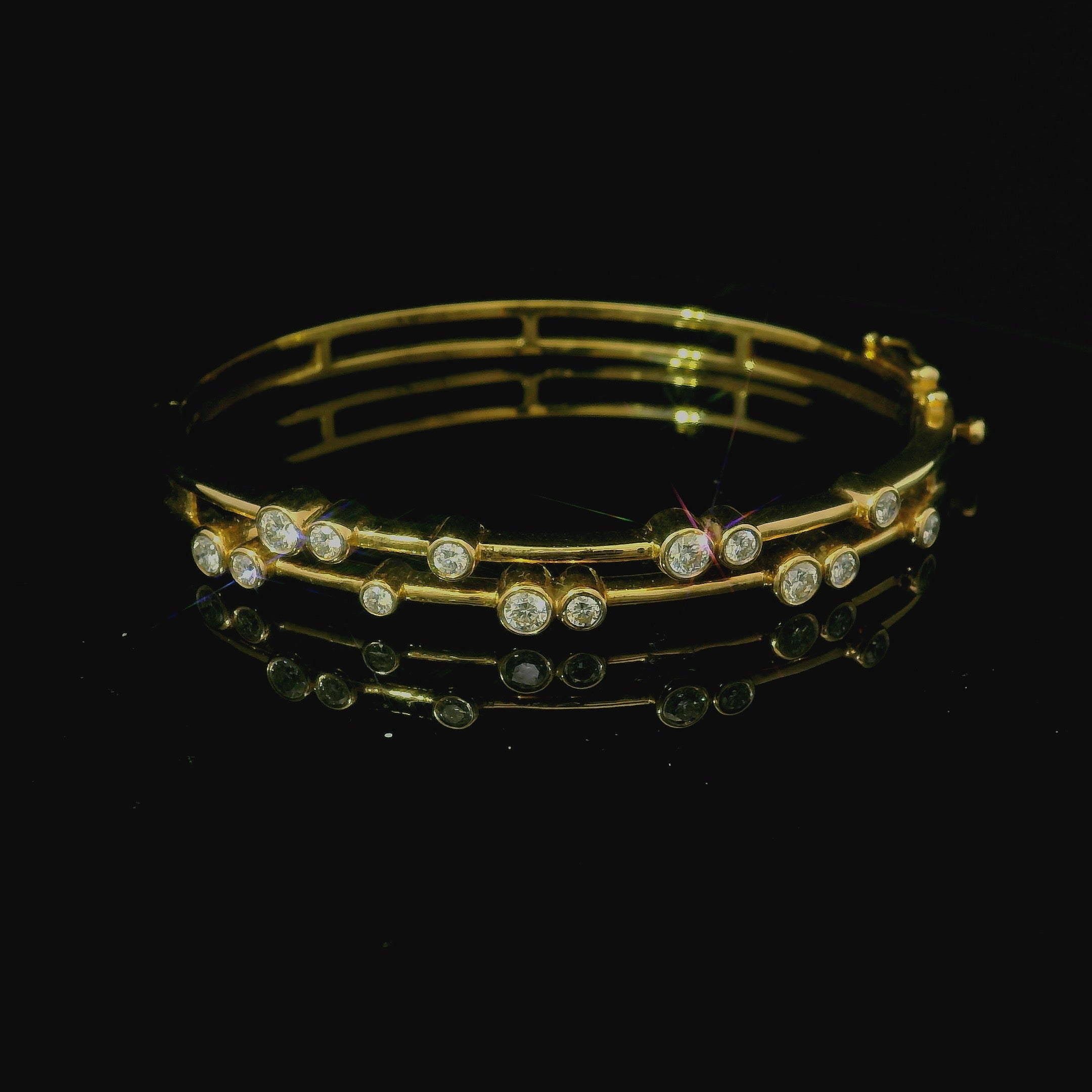 yellow gold bangle. yellow gold bracelet. yellow gold bangle with diamonds. diamond bracelet. 