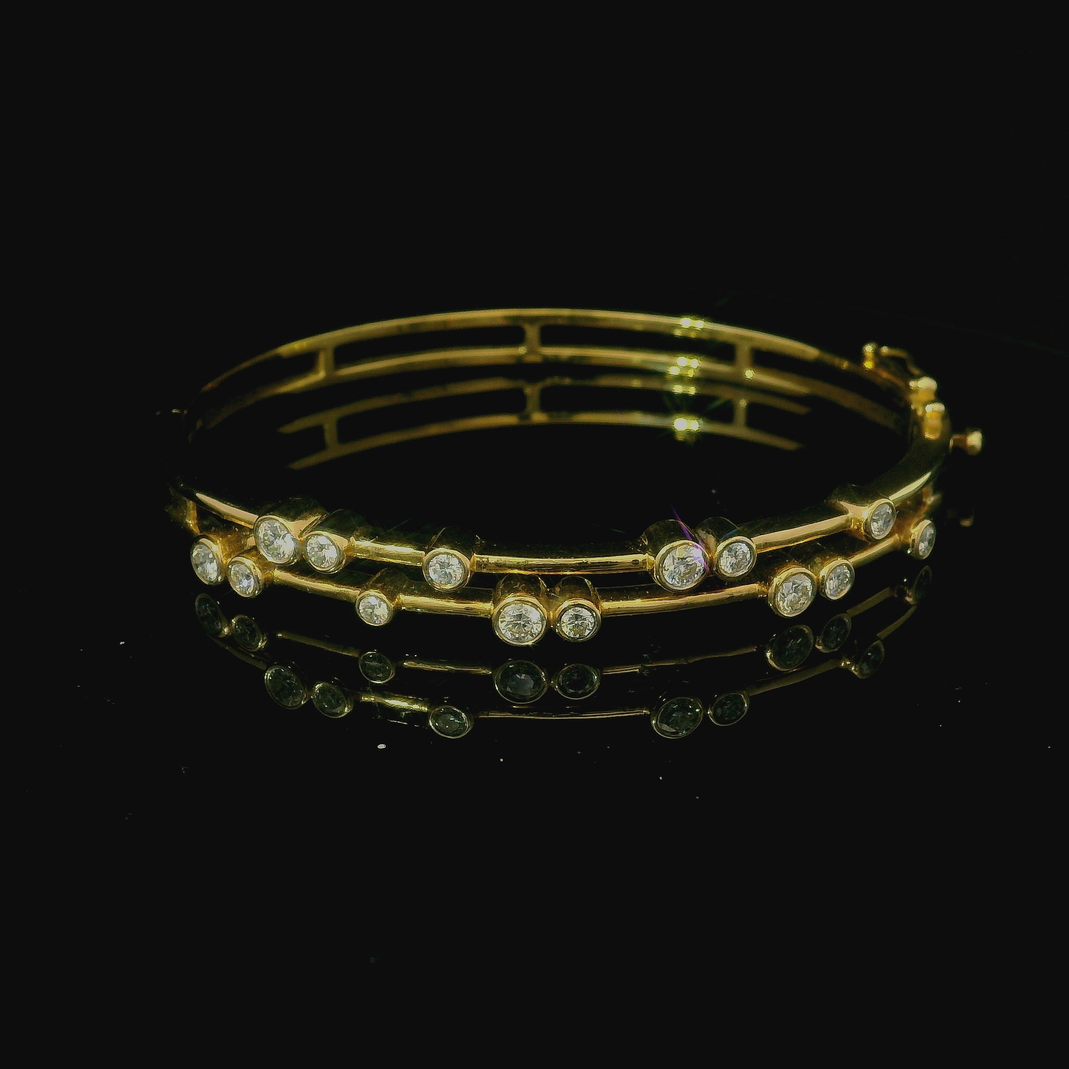 gold bangle with diamonds. kings hill. west malling