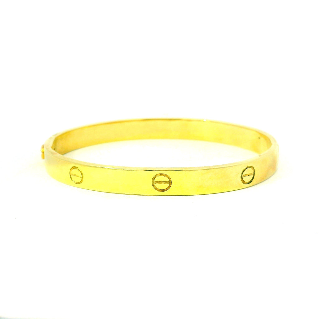 yellow gold bangle for women. screw design bangle. west malling bangles