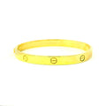 yellow gold bangle for women. screw design bangle. west malling bangles