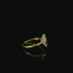 yellow gold ring with ruby. oval cut ruby with diamonds. flower shaped diamond ring. antique jewellery for women. costume jewellery