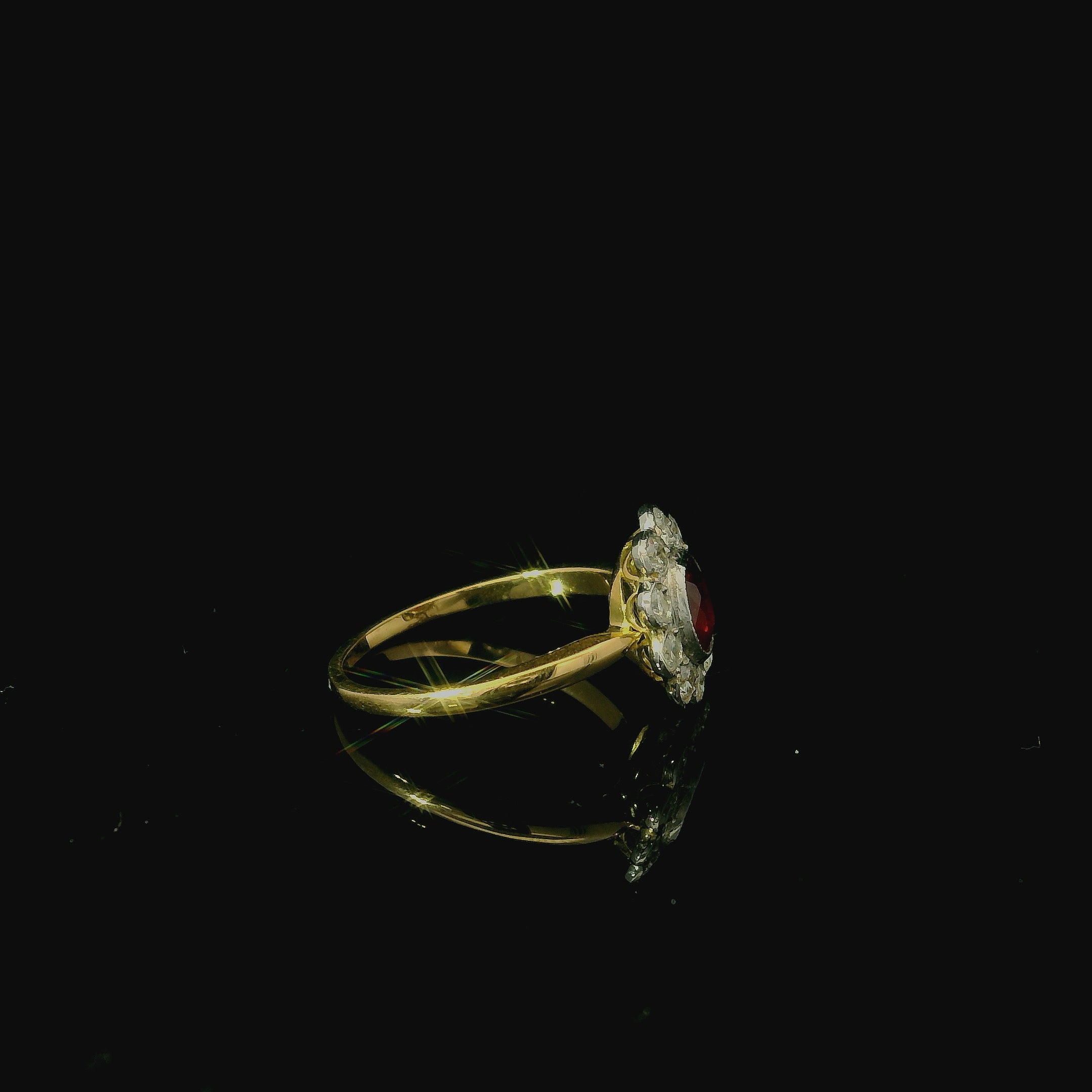 yellow gold ring with ruby. oval cut ruby with diamonds. flower shaped diamond ring. antique jewellery for women. costume jewellery