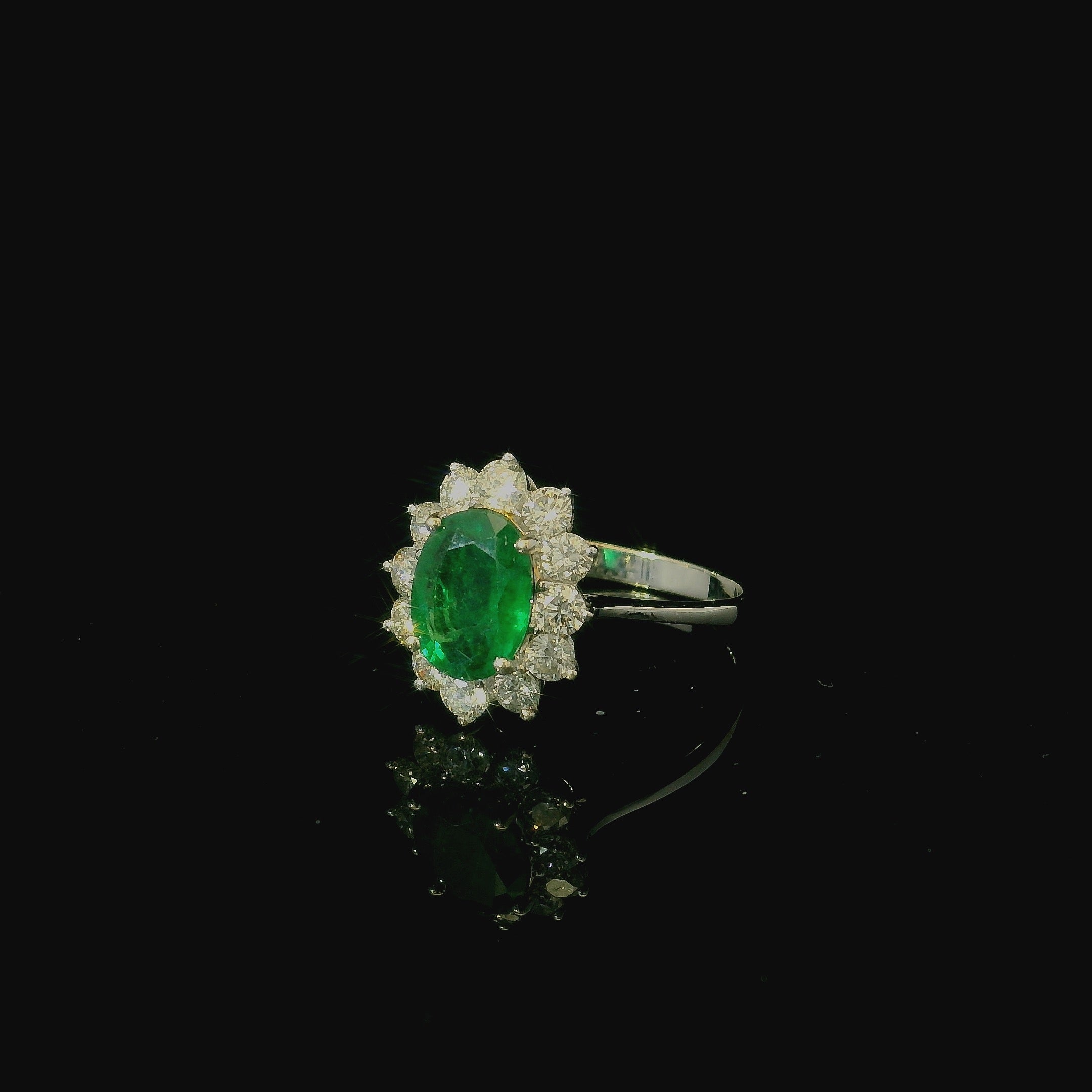 emerald solitaire white gold ring. brilliant cut diamond stones. engagement rings west malling. maidstone. tunbridge wells. sevenoaks. bespoke ring design.