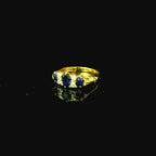 gold ring. blue gem stone. blue stones on ring. gold ring with blue