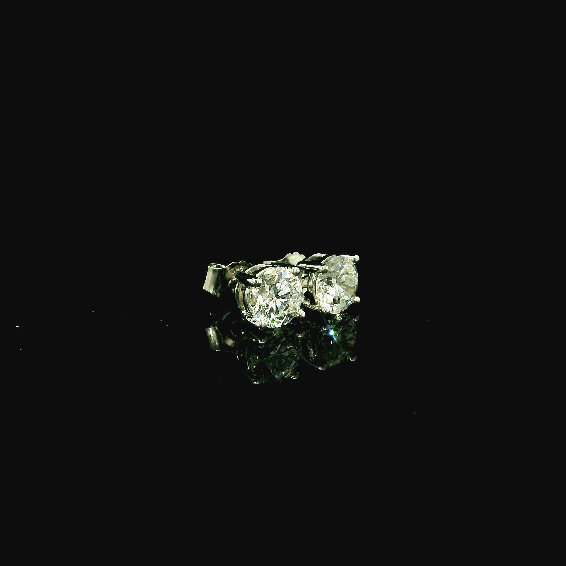 platinum stud earrings with diamonds. diamond stud earrings for women. diamonds for women