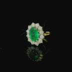 oval cut emerald and diamond ring. white and yellow gold vintage and antique ring. costume jewellery. bold statement ring for women