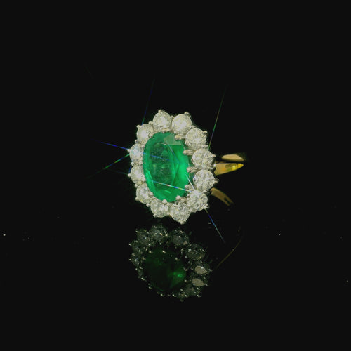 oval cut emerald and diamond ring. white and yellow gold vintage and antique ring. costume jewellery. bold statement ring for women