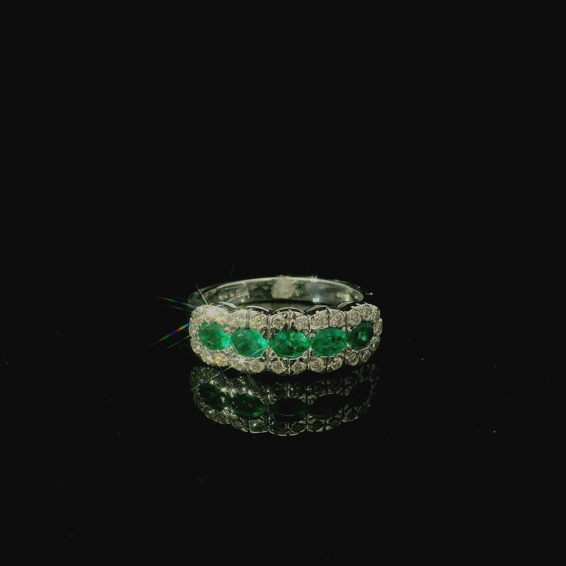 18ct white gold ring with emeralds and diamonds. green emerald gemstone ring. west malling