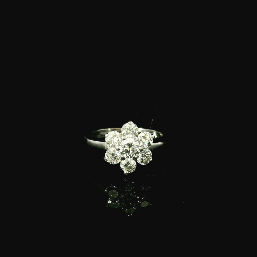 white gold daisy inspired ring for women with diamonds.