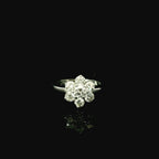 white gold daisy inspired ring for women with diamonds.