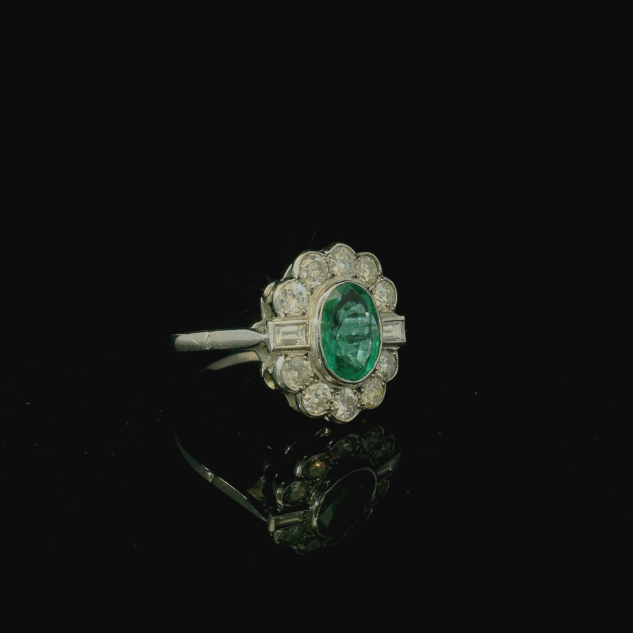 oval emerald on white gold ring. white gold engagement ring for women. wedding bands for women. vintage jewellery 
