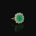pale green cushion cut emerald green stone ring. white and yellow gold ring. 