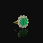 pale green cushion cut emerald green stone ring. white and yellow gold ring. 