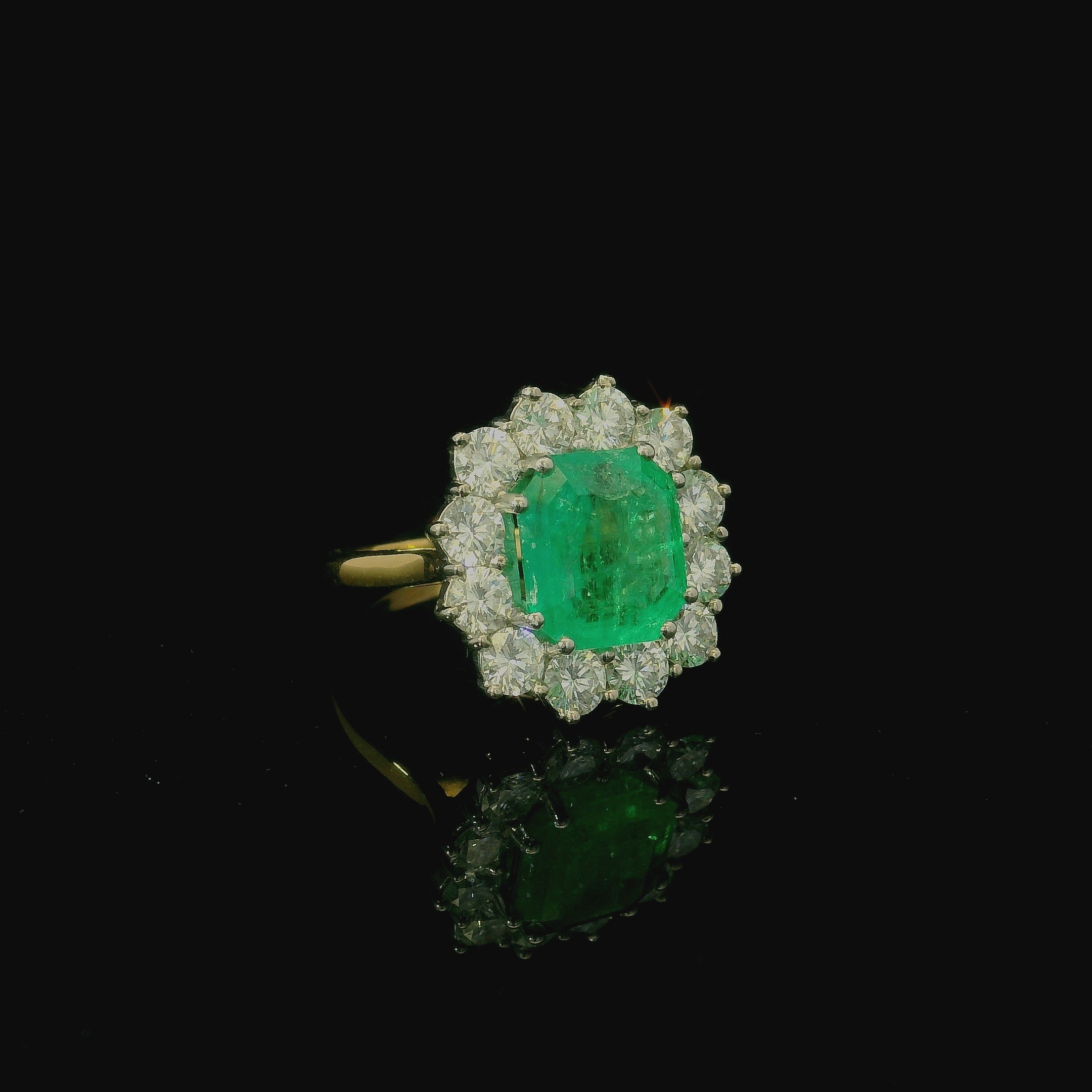 pale green cushion cut emerald green stone ring. white and yellow gold ring. 