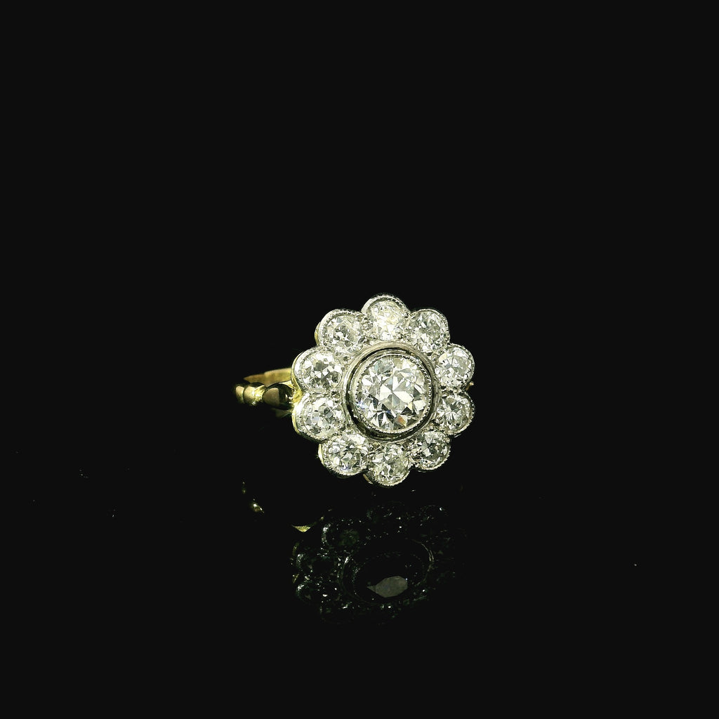 daisy shaped diamond ring for women. yellow gold and platinum diamond ring. floral shaped ring for women.