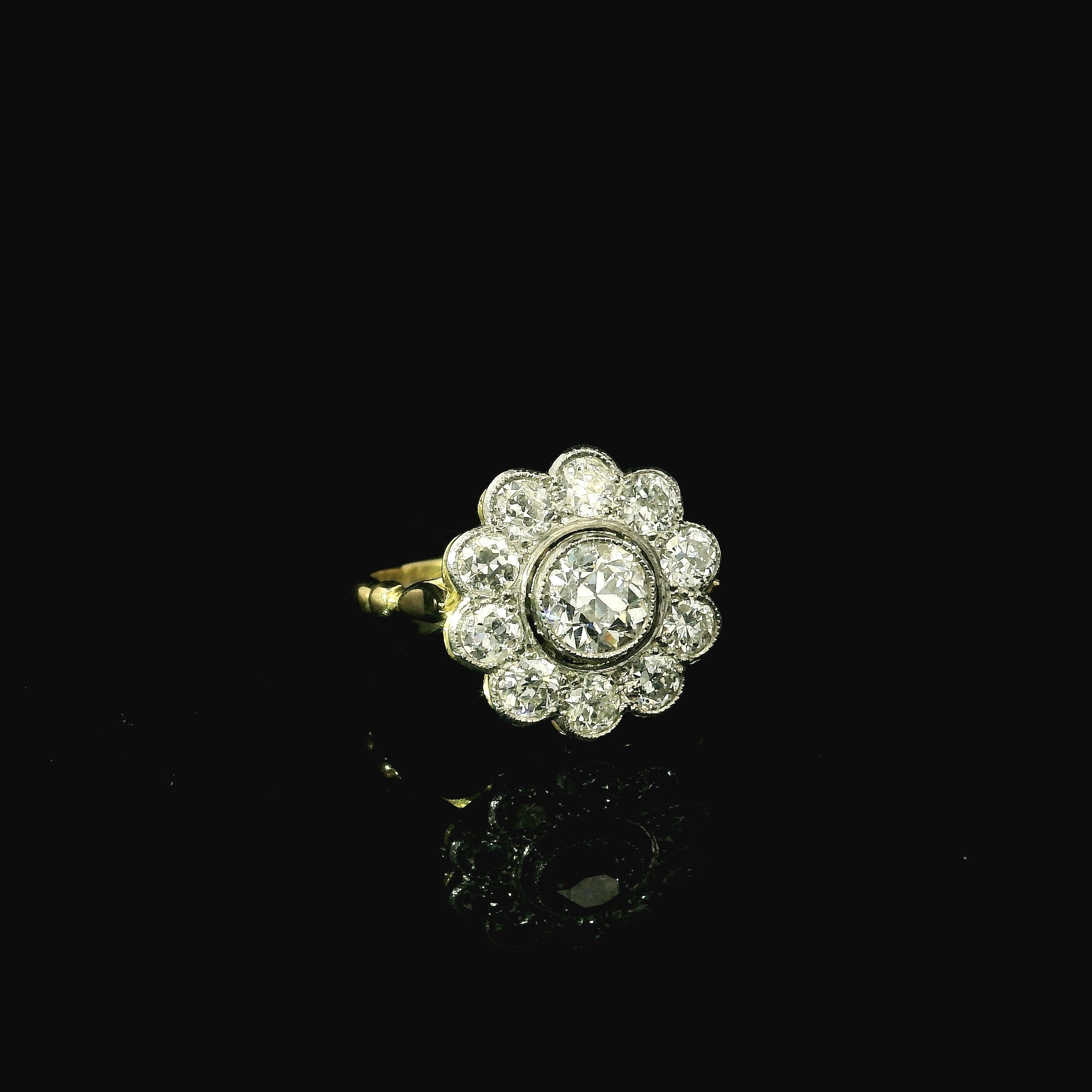 daisy shaped diamond ring for women. yellow gold and platinum diamond ring. floral shaped ring for women.