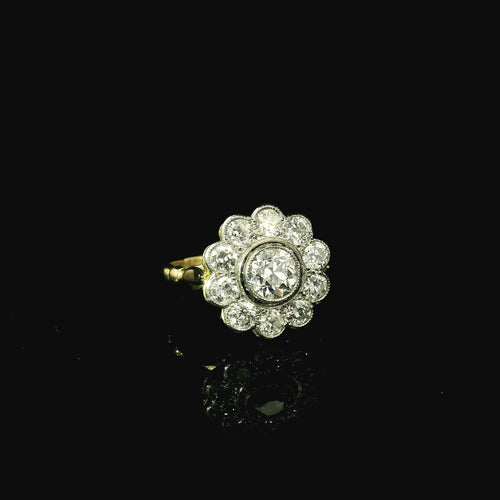 daisy shaped diamond ring for women. yellow gold and platinum diamond ring. floral shaped ring for women.