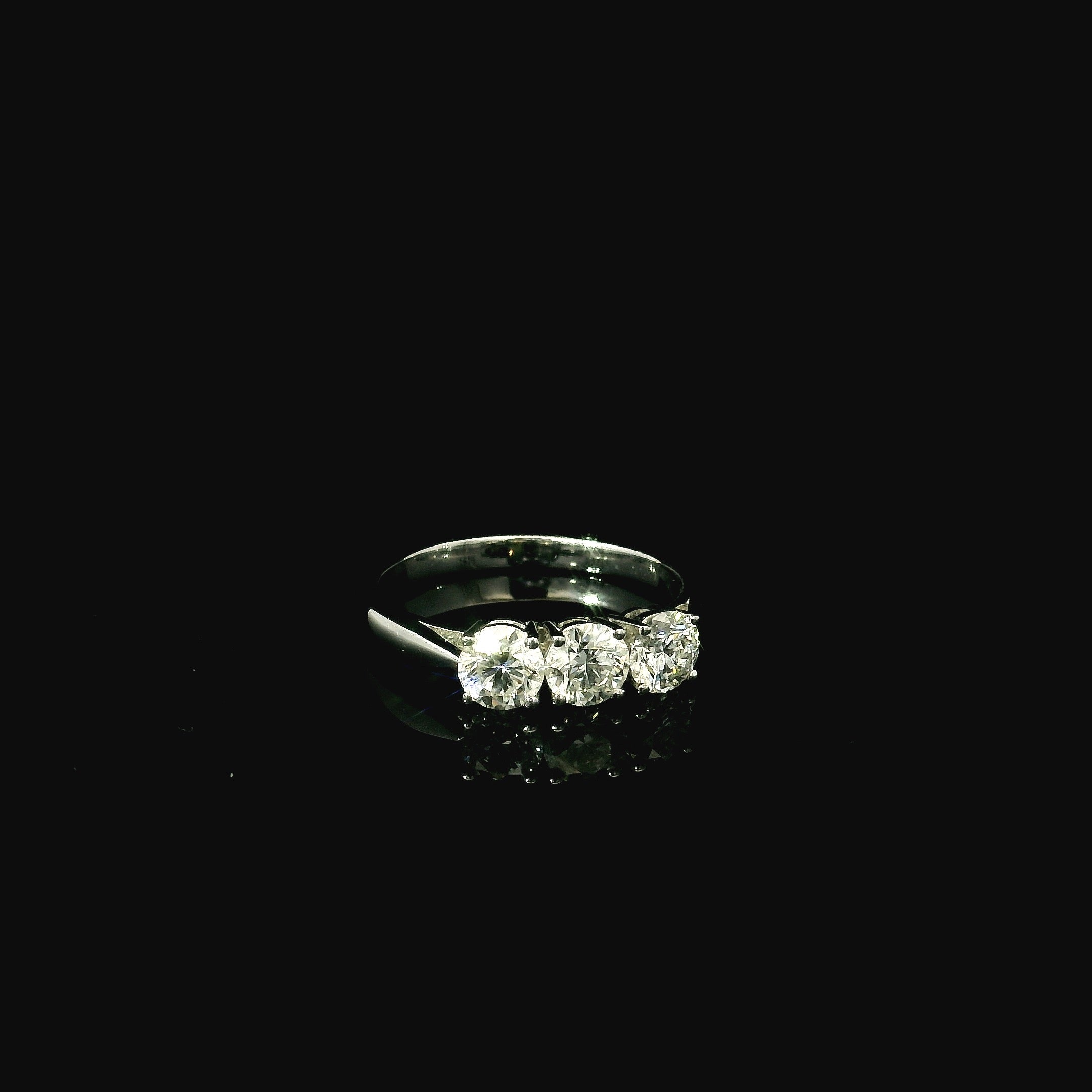 platinum wedding band ring for women. simple elegant band diamond ring. three diamonds on a platinum ring