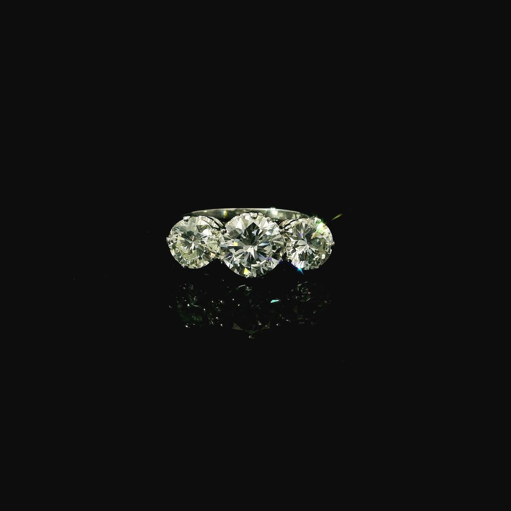 luxury 3 diamond ring. platinum preowned ring for women. modern diamond ring.
