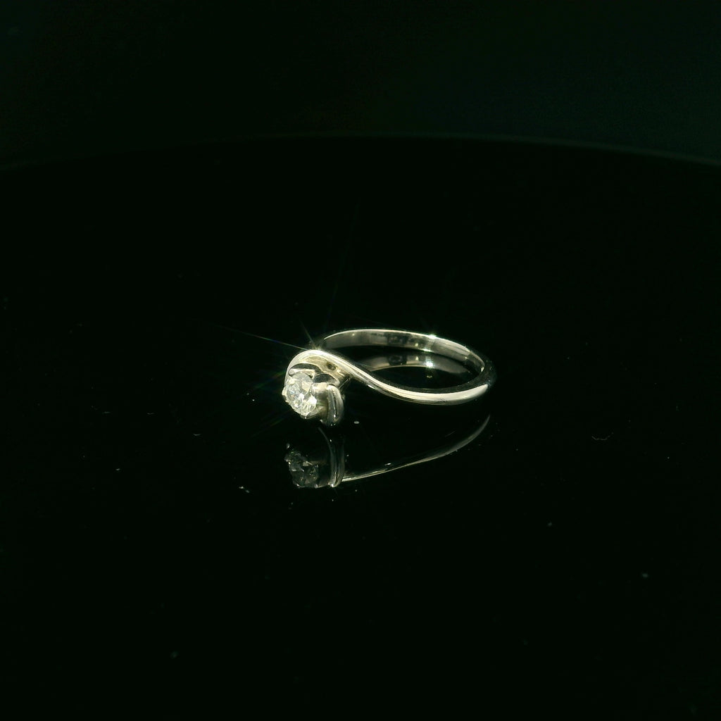 twisted mount platinum diamond ring. diamond ring for women. twisted mount jewellery