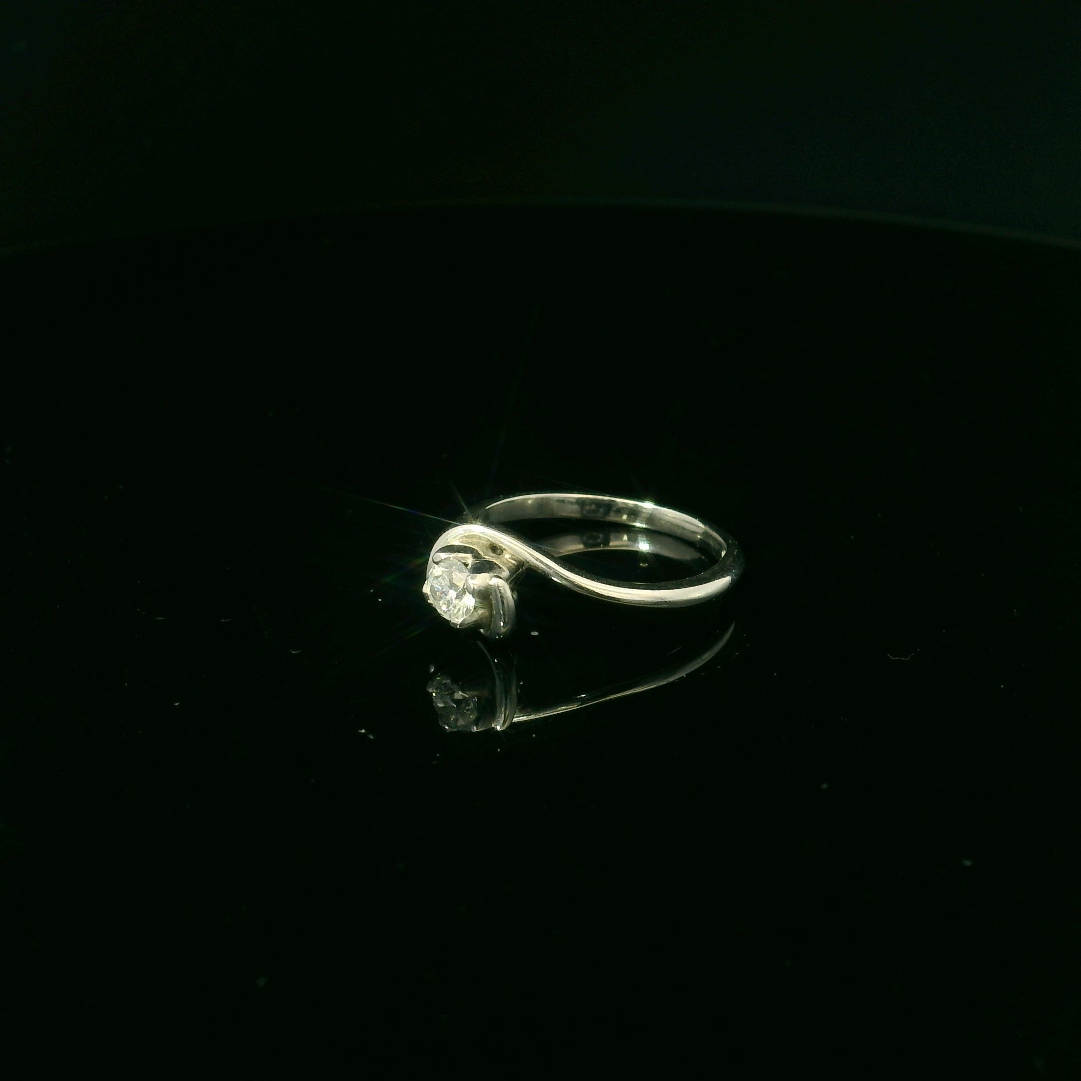 twisted mount platinum diamond ring. diamond ring for women. twisted mount jewellery