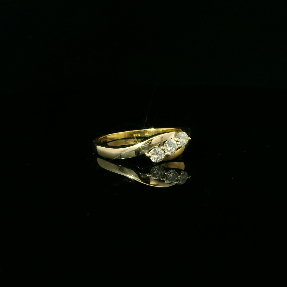 18ct yellow and white gold ring, 3 round brilliant cut diamond = 0.33ct, crossover design
