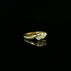18ct yellow and white gold ring, 3 round brilliant cut diamond = 0.33ct, crossover design