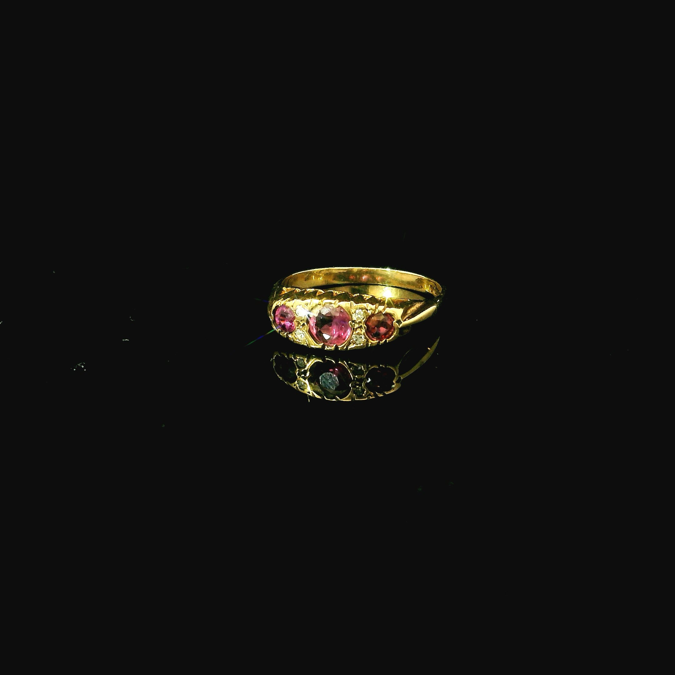 gold ring with pink ruby stones. ruby and diamond ring west malling kent