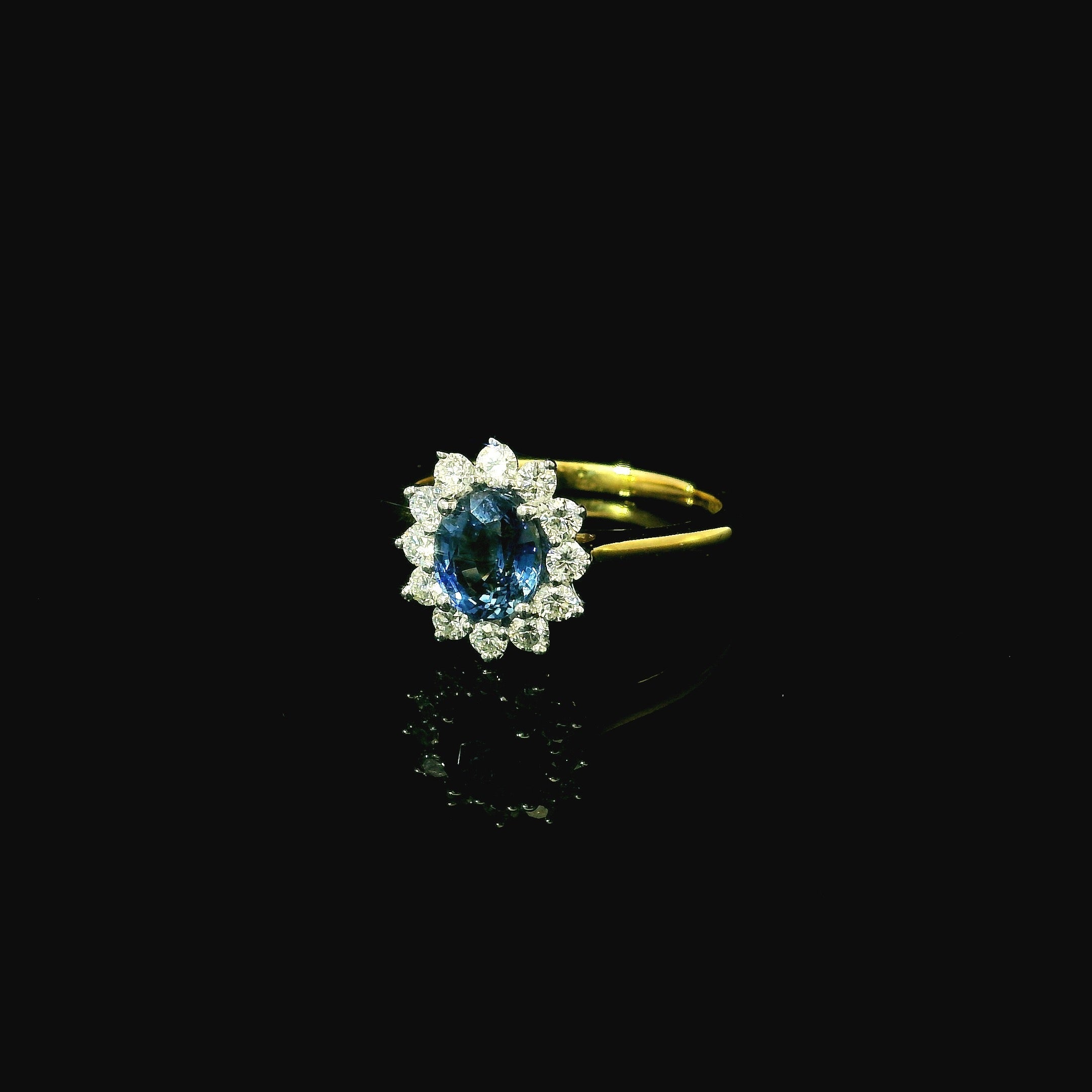 sapphire gem stone. diamond cluster. floral engagement ring