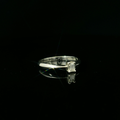 white gold simple ring. emerald cut diamond
