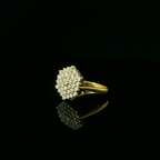 18ct white and yellow gold diamond daisy cluster, total diamonds = 0.75ct