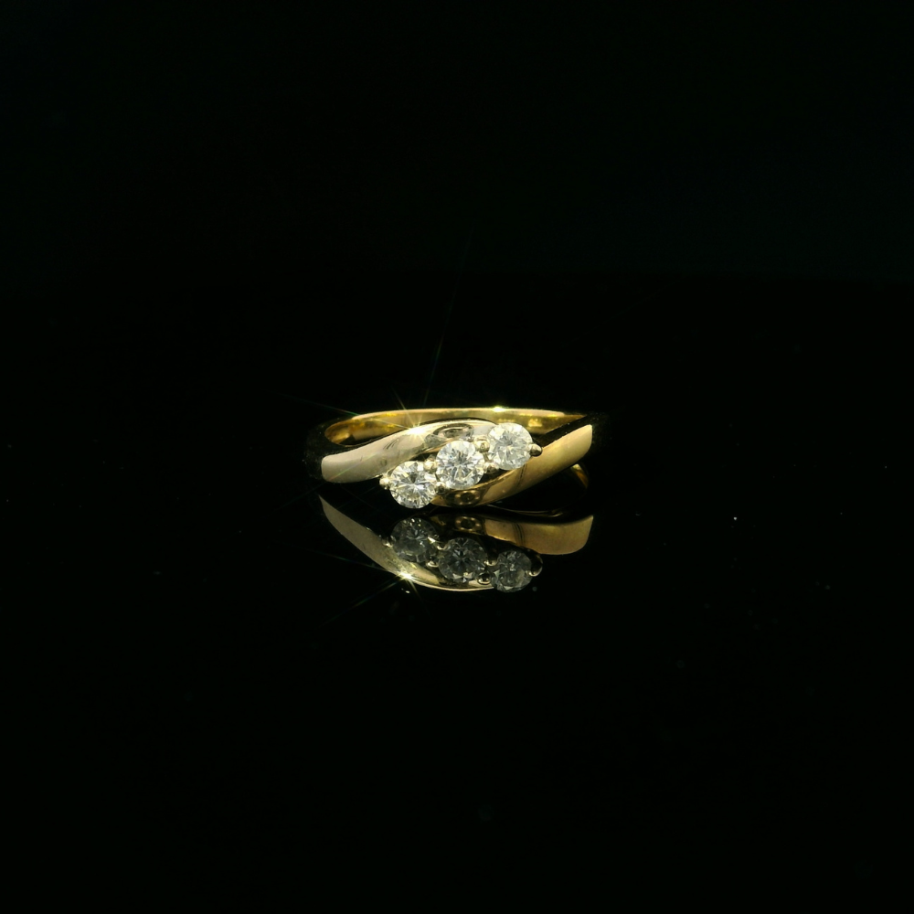 18ct yellow and white gold ring, 3 round brilliant cut diamond = 0.33ct, crossover design